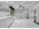 Primary bathroom featuring double sink vanity, soaking tub, walk-in closet, and lots of natural light at 5302 Greenway Dr, Villa Rica, GA 30180