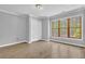 Bedroom with hardwood floors, natural light and a double closet at 5302 Greenway Dr, Villa Rica, GA 30180