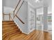 Traditional foyer features hardwood floors and stairs leading up to the next level at 5302 Greenway Dr, Villa Rica, GA 30180