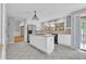 Light and airy kitchen features tile floors, an island cooktop, and stainless steel refrigerator at 5302 Greenway Dr, Villa Rica, GA 30180