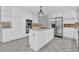 Light kitchen featuring a tile floor, stainless appliances and view to the deck at 5302 Greenway Dr, Villa Rica, GA 30180