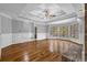 Open living room features hardwood floors, fireplace, and bay window offering plenty of natural light at 5302 Greenway Dr, Villa Rica, GA 30180