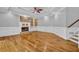Open living room features hardwood floors, fireplace, white trim, and neutral paint at 5302 Greenway Dr, Villa Rica, GA 30180