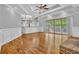 Spacious living room offers hardwood floors, fireplace, deck access, and recessed lights at 5302 Greenway Dr, Villa Rica, GA 30180