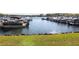 Waterfront view of a lake with multiple boats docked in the marina at 5302 Greenway Dr, Villa Rica, GA 30180