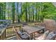 Back deck offering outdoor seating with wooded view at 183 Oak Dr, Atlanta, GA 30354
