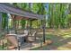 Relaxing backyard patio with seating under a shaded pergola at 183 Oak Dr, Atlanta, GA 30354