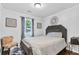 Comfortable bedroom featuring a plush bed, natural light, and stylish accents at 183 Oak Dr, Atlanta, GA 30354