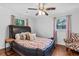 Cozy bedroom features a large leather bed and ceiling fan at 183 Oak Dr, Atlanta, GA 30354