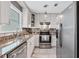 Bright kitchen featuring white cabinets, stainless steel appliances, and granite countertops at 183 Oak Dr, Atlanta, GA 30354