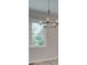 Dining area with a modern chandelier and a large window with a green view at 1976 Deco Dr, Kennesaw, GA 30144