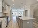 Bright, spacious kitchen with stainless steel appliances, a central island, and stylish pendant lighting at 1976 Deco Dr, Kennesaw, GA 30144