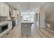 Kitchen with stainless steel appliances, quartz countertops, and open floor plan at 1976 Deco Dr, Kennesaw, GA 30144