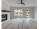 Bright living room with a fireplace, large windows, and stylish flooring at 1976 Deco Dr, Kennesaw, GA 30144