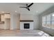 Open living area with fireplace, ceiling fan, and direct access to the kitchen at 1976 Deco Dr, Kennesaw, GA 30144