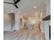 Open-concept living space features a fireplace, staircase, and view into the modern kitchen at 1976 Deco Dr, Kennesaw, GA 30144