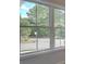 A view from the window of a quiet street and lush trees at 1976 Deco Dr, Kennesaw, GA 30144