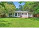 This home features a level backyard and lush, mature trees at 2205 Desmond Dr, Decatur, GA 30033