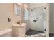 Modern bathroom featuring a glass shower enclosure, vanity, and tiled accents at 2205 Desmond Dr, Decatur, GA 30033