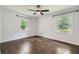 Cozy bedroom featuring two windows and hardwood flooring at 2205 Desmond Dr, Decatur, GA 30033
