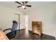 This cozy bedroom is complete with hardwood floors and a ceiling fan at 2205 Desmond Dr, Decatur, GA 30033