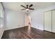 This bedroom features hardwood floors, a ceiling fan and a closet for ample storage at 2205 Desmond Dr, Decatur, GA 30033