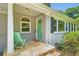 Inviting front porch with a green door, white trim, and two chairs at 2205 Desmond Dr, Decatur, GA 30033