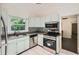 Bright kitchen featuring stainless steel appliances, granite countertops, and modern backsplash at 2205 Desmond Dr, Decatur, GA 30033