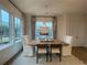 Elegant dining room with a wooden table, chandelier, and large windows for natural light at 920 Hughley Circle # 74, Atlanta, GA 30316