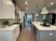 Modern kitchen featuring white cabinets, stainless steel appliances, and a large island with seating at 920 Hughley Circle # 74, Atlanta, GA 30316
