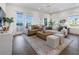 Bright living room features lots of natural light, neutral-toned furniture, and hardwood floors at 920 Hughley Circle # 74, Atlanta, GA 30316