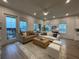 Spacious living area with light-filled windows, hardwood floors, and stylish neutral furnishings at 920 Hughley Circle # 74, Atlanta, GA 30316