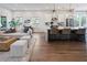 Open floor plan with a kitchen island, living area, hardwood floors and modern decor at 920 Hughley Circle # 74, Atlanta, GA 30316