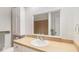 Bright bathroom featuring a large mirror and clean white sink at 2100 Ann Se Ct, Conyers, GA 30013