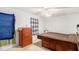 Cozy bedroom featuring a dresser and a bed with built-in storage drawers at 2100 Ann Se Ct, Conyers, GA 30013