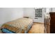 Old bedroom with worn wooden floors and minimal furnishings under natural light at 2100 Ann Se Ct, Conyers, GA 30013