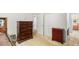 Spacious bedroom with multiple dressers and an en-suite bathroom view at 2100 Ann Se Ct, Conyers, GA 30013