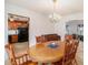 Traditional dining room showcasing a wood table, piano and view into the kitchen at 2100 Ann Se Ct, Conyers, GA 30013