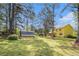 Wide backyard with shed and a view of the home's exterior at 2100 Ann Se Ct, Conyers, GA 30013