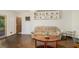 Comfortable living room with wood floors, a patterned sofa, and decorative bird figurines at 2100 Ann Se Ct, Conyers, GA 30013