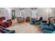 Spacious living room with multiple seating areas, carpeted floors and ample natural light at 2100 Ann Se Ct, Conyers, GA 30013