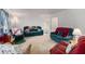 Spacious living room with multiple seating areas and neutral carpet at 2100 Ann Se Ct, Conyers, GA 30013