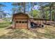 Rustic outbuilding providing ample storage or workshop potential at 2100 Ann Se Ct, Conyers, GA 30013