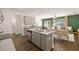 Open concept living and kitchen space with granite counters and stainless appliances at 329 Elgin Dr # 157, Lawrenceville, GA 30045
