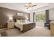 Spacious bedroom featuring tray ceiling and sitting area at 329 Elgin Dr # 157, Lawrenceville, GA 30045