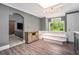 Spacious bathroom with a soaking tub, stylish gray walls, and modern finishes at 387 Nickajack Se Rd, Mableton, GA 30126