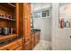 Cozy bathroom featuring a decorative sink, granite countertop and built-in shelving at 387 Nickajack Se Rd, Mableton, GA 30126