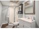 Well-lit bathroom with modern fixtures, glass enclosed shower, and a large mirror at 387 Nickajack Se Rd, Mableton, GA 30126