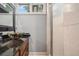 Bathroom featuring granite countertop with decorative bowl sink and a walk-in shower at 387 Nickajack Se Rd, Mableton, GA 30126