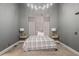 Modern bedroom featuring a padded headboard, sleek nightstands, and soft carpeting at 387 Nickajack Se Rd, Mableton, GA 30126